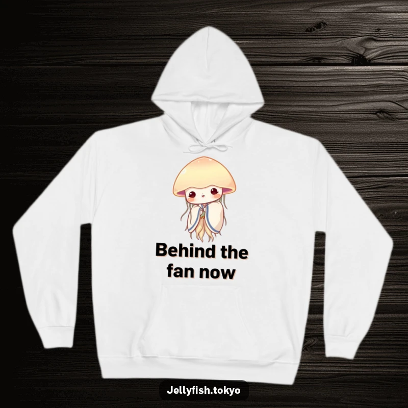Funny shy jellyfish in a soft kimono, peeking from behind a fan, adorning a cozy and warm hoodie.