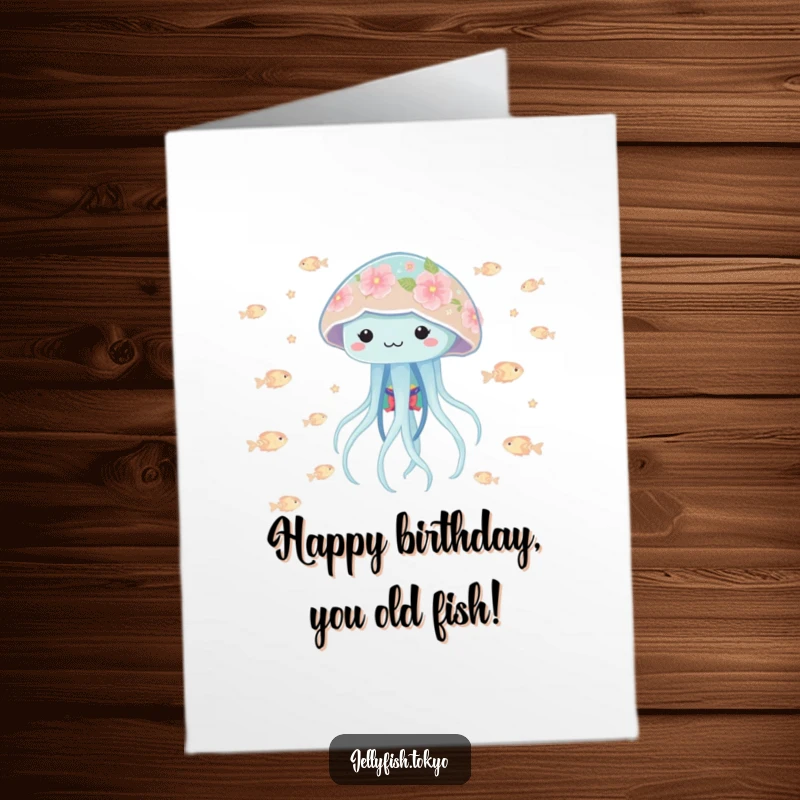 Funny Free Printable Birthday Card: Playful jellyfish in floral kimono bobbing with glowing fish, a delightful downloadable greeting.